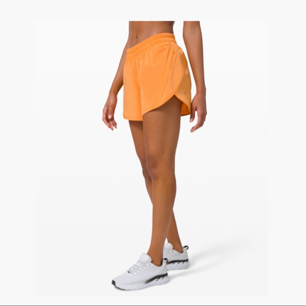 COPY - Orange Lululemon track that short 5” size …